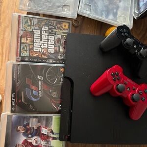 Sony PlayStation 3 Slim Console with Red and Black Wireless Controllers